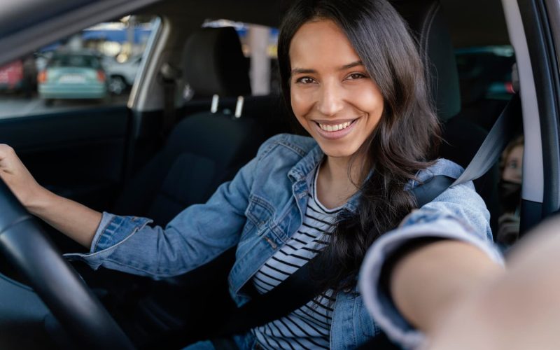 brunette-woman-taking-selfie-her-car-1.jpg